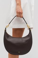 Profile view of model wearing the Oroton Florence Medium Hobo in Mahogany and  for Women