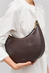 Profile view of model wearing the Oroton Florence Medium Hobo in Mahogany and  for Women