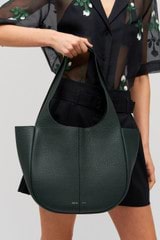 Profile view of model wearing the Oroton Emilia Tote in Vine and  for Women