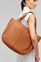 Profile view of model wearing the Oroton Emilia Large Tote in Brandy and  for Women