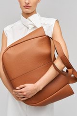 Profile view of model wearing the Oroton Emilia Large Tote in Brandy and  for Women