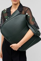 Profile view of model wearing the Oroton Emilia Large Tote in Vine and  for Women