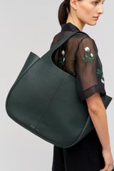 Profile view of model wearing the Oroton Emilia Large Tote in Vine and  for Women