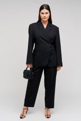 Profile view of model wearing the Oroton Wrap Blazer in Black and 98% wool,  2% elastane material for Women