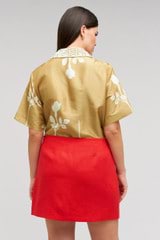 Profile view of model wearing the Oroton Embellished Rosebud Camp Shirt in Camel and 100% Silk Material for Women