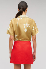 Profile view of model wearing the Oroton Embellished Rosebud Camp Shirt in Camel and 100% Silk Material for Women