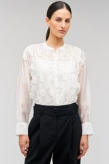 Profile view of model wearing the Oroton Scallop Lace Overshirt in White and 85% Tencel 15% Polyester for Women