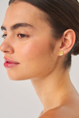 Profile view of model wearing the Oroton Sage Cluster Studs in Worn Gold and  for Women