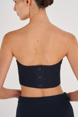 Profile view of model wearing the Oroton Knit Bandeau in North Sea and 83% Viscose, 17% Polyester for Women