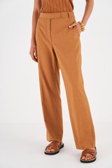 Profile view of model wearing the Oroton Wide Leg Pant in Toffee and 81% Viscose 17% Cotton 2% Elastane for Women