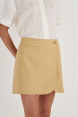 Profile view of model wearing the Oroton Pocket Detail Skirt in Raffia and 81% Viscose, 17% Cotton, 2% Elastane for Women