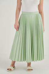 Profile view of model wearing the Oroton Pleat Skirt in Herb Garden and 65% Polyester, 35% Cotton for Women