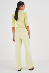 Profile view of model wearing the Oroton Pintuck Pant in Pistachio and 58% Viscose 42% Linen for Women