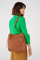Profile view of model wearing the Oroton Margot Hobo in Whiskey and Pebble leather for Women