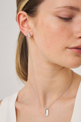 Profile view of model wearing the Oroton Zizi Necklace And Stud Gift Set in Silver/Clear and  for Women