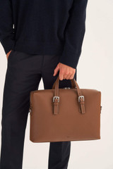Profile view of model wearing the Oroton Oxley Griptop in Tan and Pebble Leather for Men