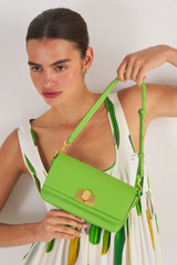 Profile view of model wearing the Oroton Kerr Small Day Bag in Garden and Smooth Leather for Women