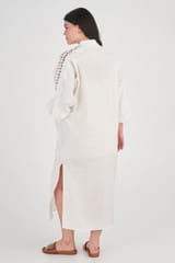 Profile view of model wearing the Oroton Geo Ric Rac Column Dress in Antique White and 100% Linen for Women