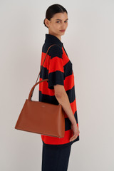 Profile view of model wearing the Oroton Muse Day Bag in Cognac and Saffiano / Smooth Leather for Women