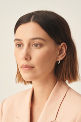 Profile view of model wearing the Oroton Violet Pearl Mini Hoops in Silver and Brass Base With Rhodium Plating for Women