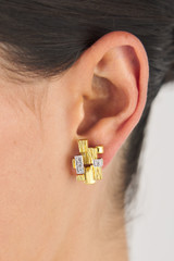 Profile view of model wearing the Oroton Leora Clip On Earring in Worn Gold/Silver/Clear and Brass base metal with precious metal plating/stone for Women