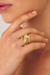 Profile view of model wearing the Oroton Sage Ring Stack in Worn Gold/White and  for Women