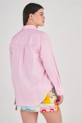 Profile view of model wearing the Oroton Poplin Long Sleeve Shirt in Foxglove and 100% Cotton for Women