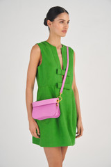 Profile view of model wearing the Oroton Liv Small Day Bag in Fuchsia and Small Pebble Leather for Women
