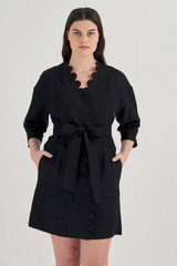 Profile view of model wearing the Oroton Short Scallop Dress in Black and 100% Linen for Women
