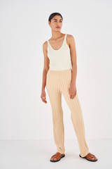 Profile view of model wearing the Oroton Rib Flare Pant in Creamed Honey and 77% Viscose 23% Polyester for Women