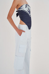 Profile view of model wearing the Oroton Pocket Pant in Sea Glass and 99% Cotton, 1% Spandex for Women