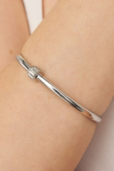 Profile view of model wearing the Oroton Kori Bangle in Silver/Clear and  for Women