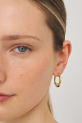 Profile view of model wearing the Oroton Kori Mini Hoops in Gold/Clear and  for Women
