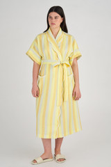 Profile view of model wearing the Oroton Long Stripe Robe in Marigold and 100% Linen for Women