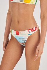 Profile view of model wearing the Oroton Ticket Print Bikini Bottom in Fuchsia and 78% Polyamide/ 22% Elastane for Women