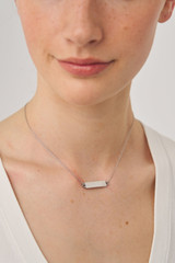 Profile view of model wearing the Oroton Zizi Necklace in Silver/Clear and  for Women