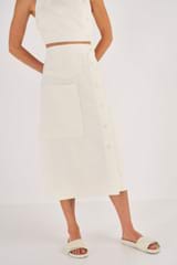 Profile view of model wearing the Oroton Utility Skirt in Soft Cream and 100% Linen for Women