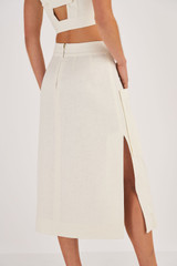Profile view of model wearing the Oroton Utility Skirt in Soft Cream and 100% Linen for Women