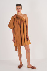 Profile view of model wearing the Oroton One Shoulder Gathered Dress in Brandy and 100% Cotton for Women