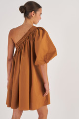 Profile view of model wearing the Oroton One Shoulder Gathered Dress in Brandy and 100% Cotton for Women