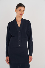 Profile view of model wearing the Oroton Stitch Detail Cardi in North Sea and 83% Viscose, 17% Polyester for Women