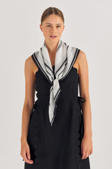 Profile view of model wearing the Oroton Polly Scarf in Black and Printed Polyester for Women