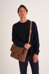 Profile view of model wearing the Oroton Oxley Satchel in Tan and Pebble Leather for Men