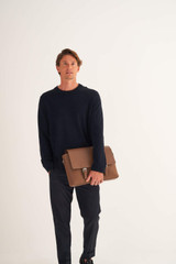 Profile view of model wearing the Oroton Oxley Satchel in Tan and Pebble Leather for Men