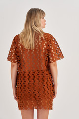 Profile view of model wearing the Oroton Short Sleeve Lace Over Shirt in Tan and 100% Polyester for Women