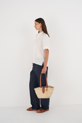 Profile view of model wearing the Oroton Madison Small Tote in Natural/Brandy and Straw/Smooth Leather Trims for Women