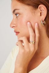 Profile view of model wearing the  Nora Hoops in Gold/Silver and Brass Base With Rhodium Plating for Women