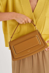 Profile view of model wearing the Oroton Perry Day Bag in Brunette and Smooth Leather for Women