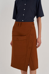 Profile view of model wearing the Oroton Utility Skirt in Tan and 100% Cotton for Women