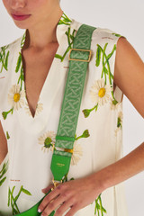 Profile view of model wearing the Oroton Logo Bag Strap in Garden and Logo Jacquard Webbing With Leather Trims for Women